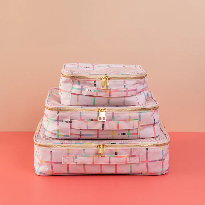 Pink packing cubes by Off the Grid